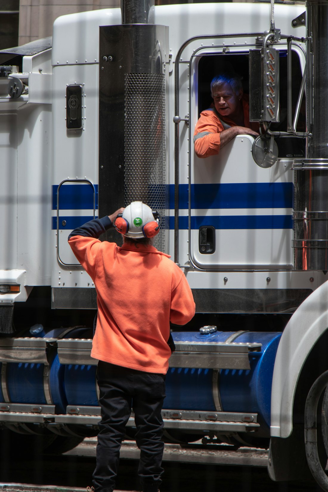 A driver checking the trailer before pickup